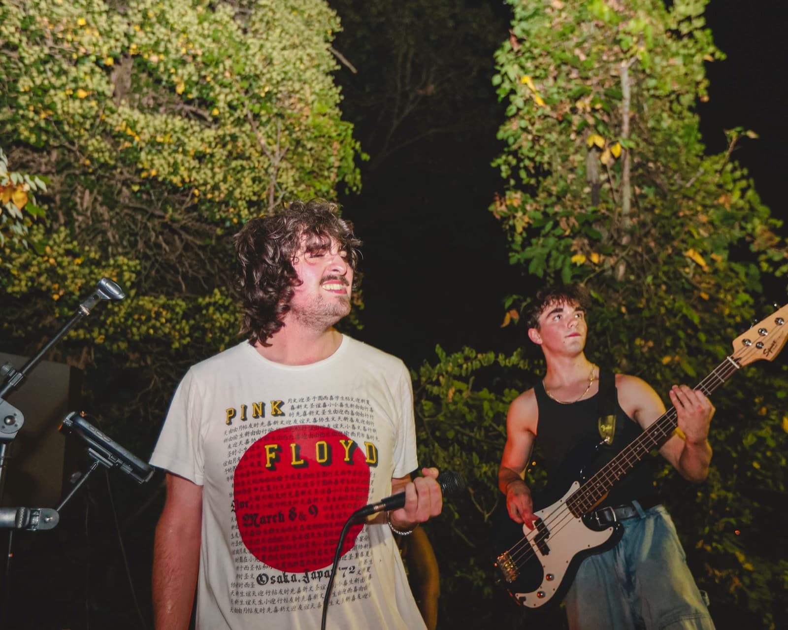 Ashton fronting a backyard show after dark