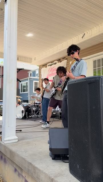 The full Fretters lineup playing a porch show