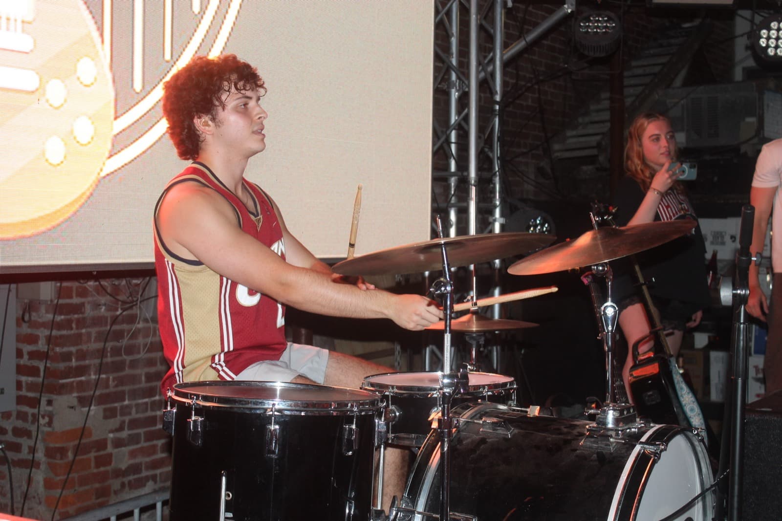 The Fretters drummer mid-hit in a Cavs jersey