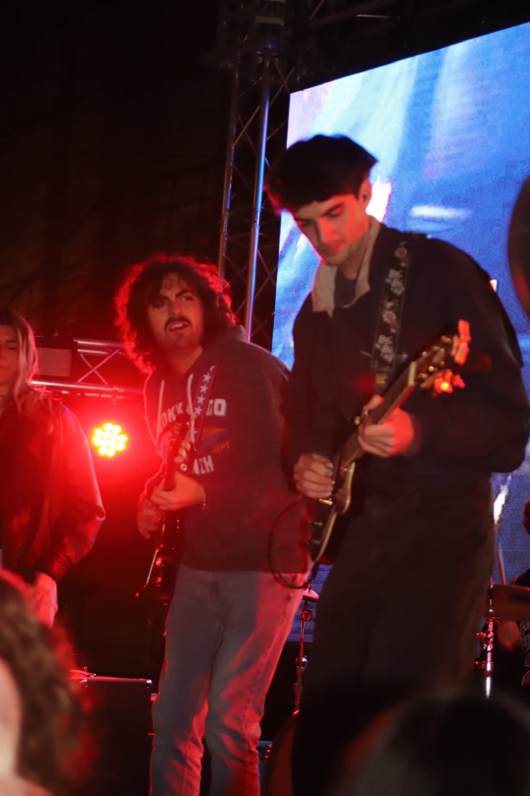 Two Fretters guitarists trading off under red light