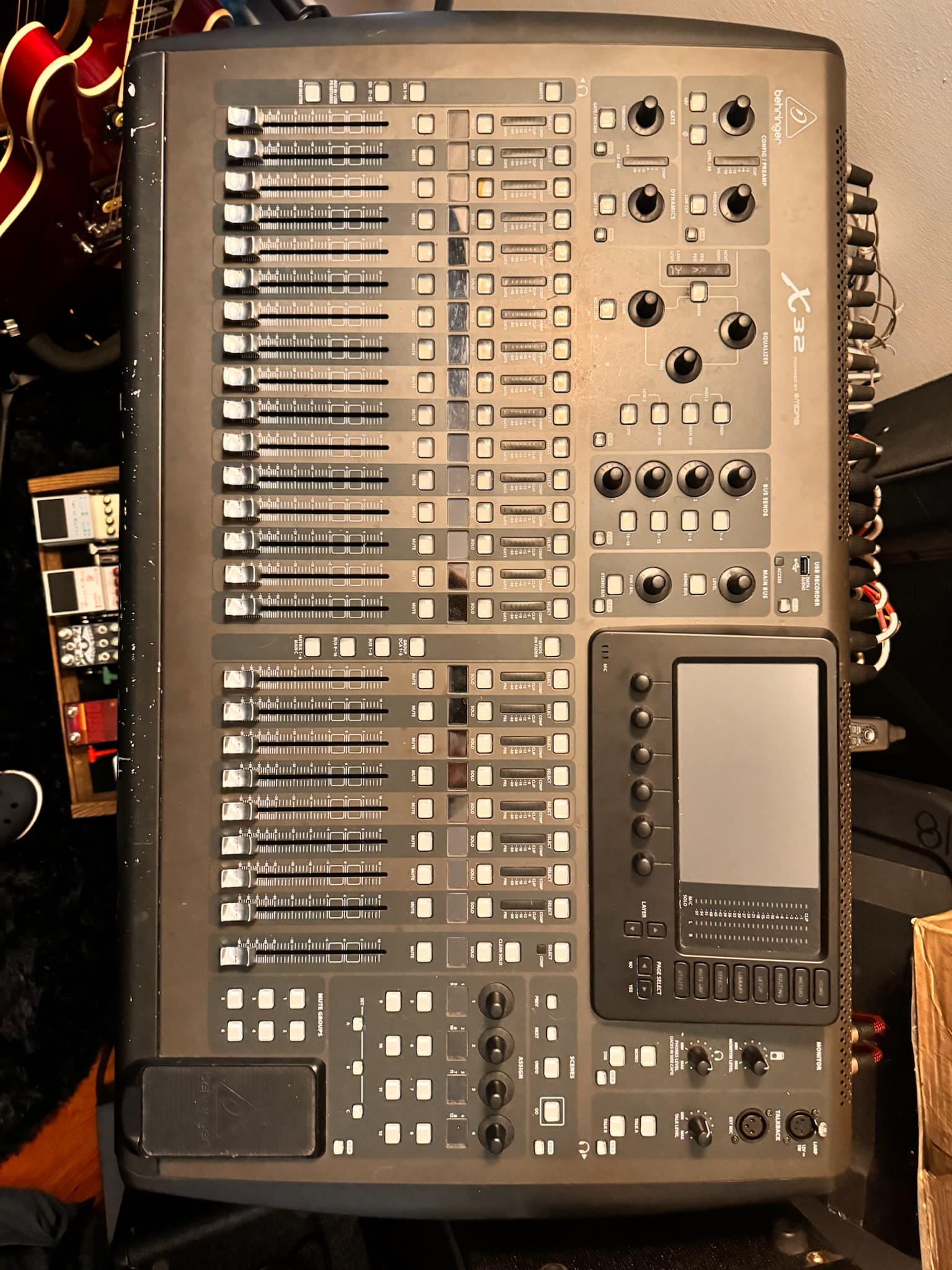 A mixing board and pedals set up for a house show