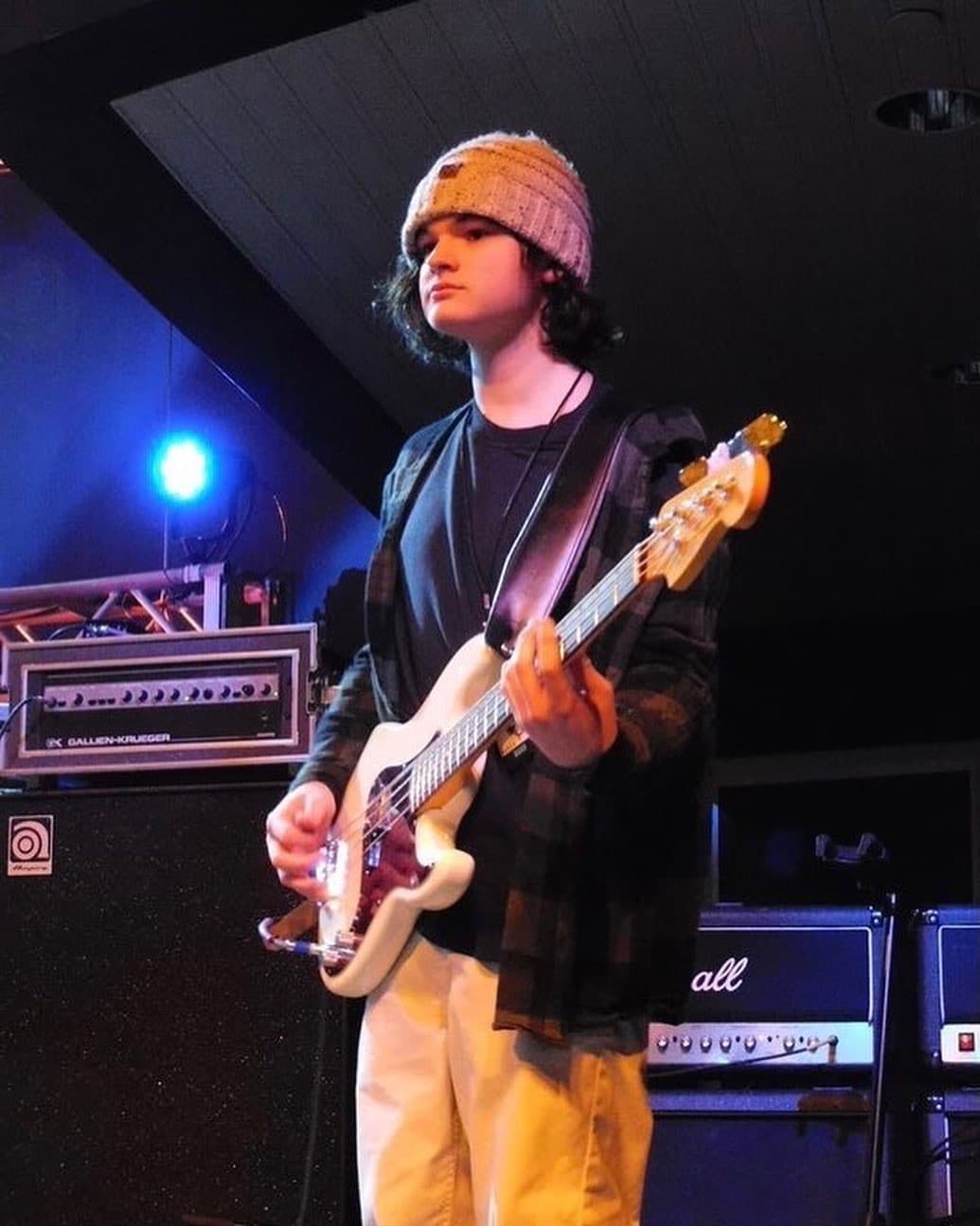 PsychoFuzz bassist under blue stage light